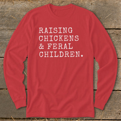 Red long sleeve shirt with white text "RAISING CHICKENS & FERAL CHILDREN."