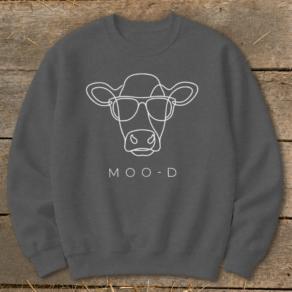 Dark gray sweatshirt with white line art of a cow wearing sunglasses and the text "MOO-D".
