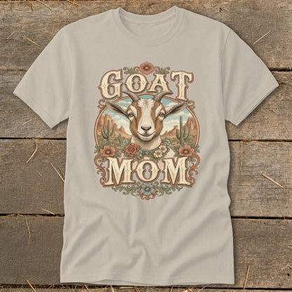 T-shirt with "GOAT MOM" text and a goat's head in a desert landscape.
