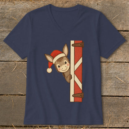 Donkey wearing Santa hat peeking from barn door on navy t-shirt.