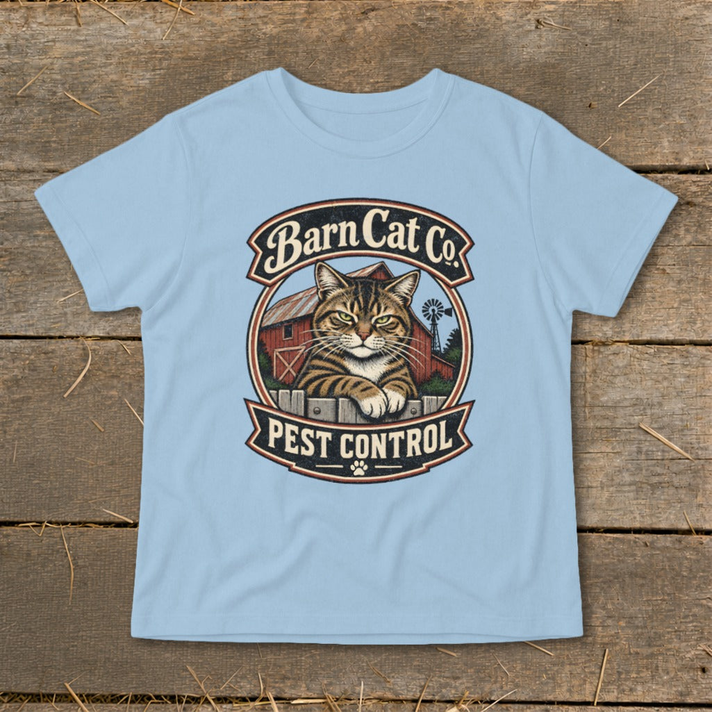 Light blue t-shirt featuring a circular graphic with a tabby cat, a red barn, and the text Barn Cat Co. Pest Control.
