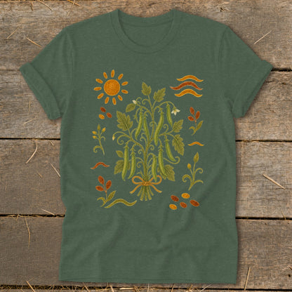 Green t-shirt with illustration of pea plant, sun, and leaves.