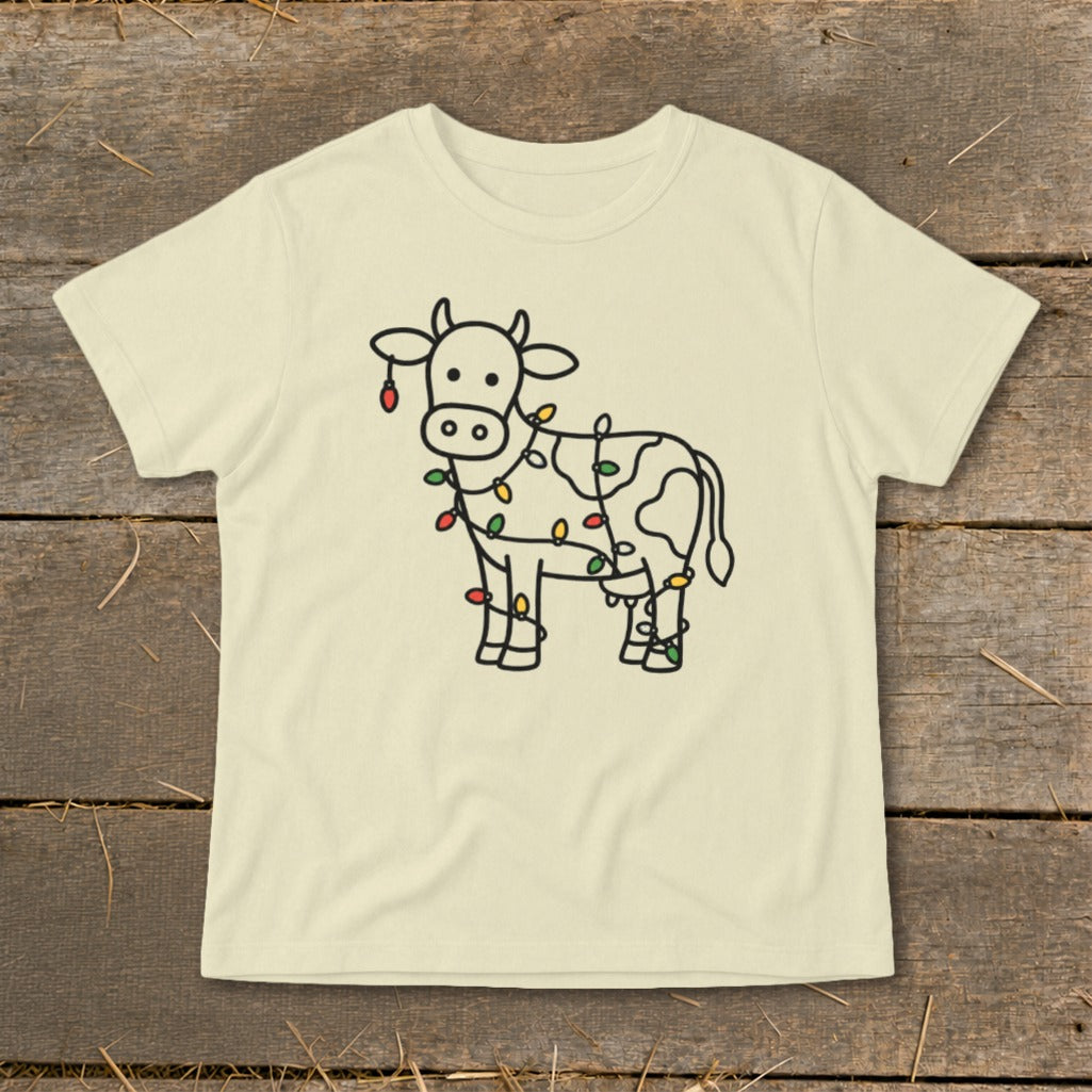 Light cream t-shirt with black line drawing of a cow covered in colorful Christmas lights.