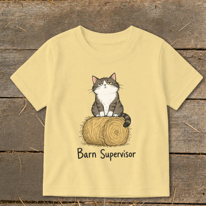Light yellow t-shirt with a cartoon cat sitting on a hay bale, text "Barn Supervisor".