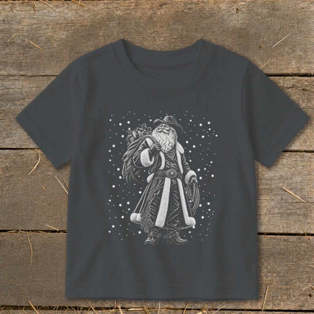 Santa Claus wearing a cowboy hat and duster, carrying a sack of gifts and a lasso.