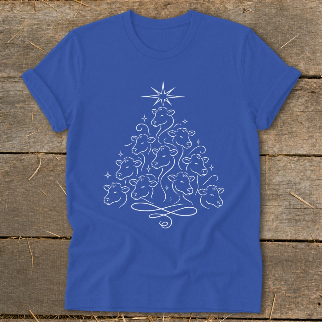 Blue t-shirt with a white line drawing of cows forming a Christmas tree shape.