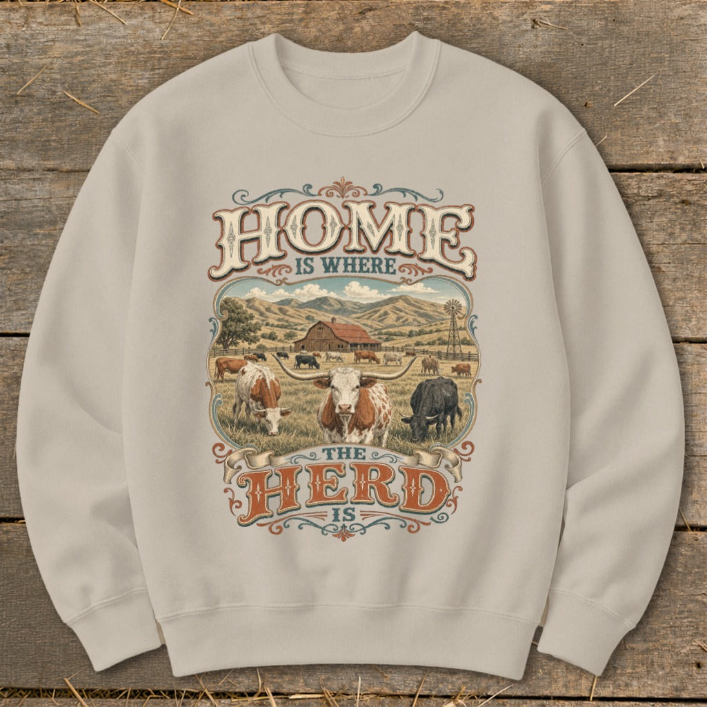 Crewneck sweatshirt with a rustic farm graphic and the text "HOME IS WHERE THE HERD IS".