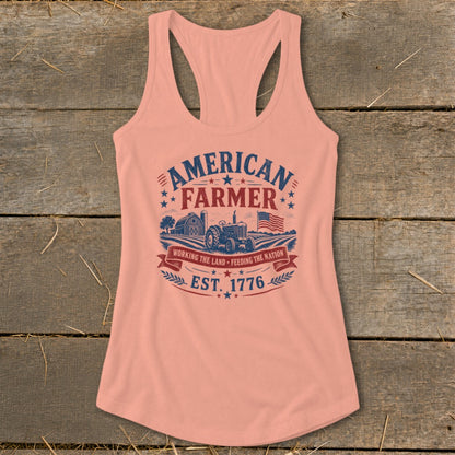 Peach tank top with "American Farmer" text, tractor, barn, flag, and "Est. 1776".