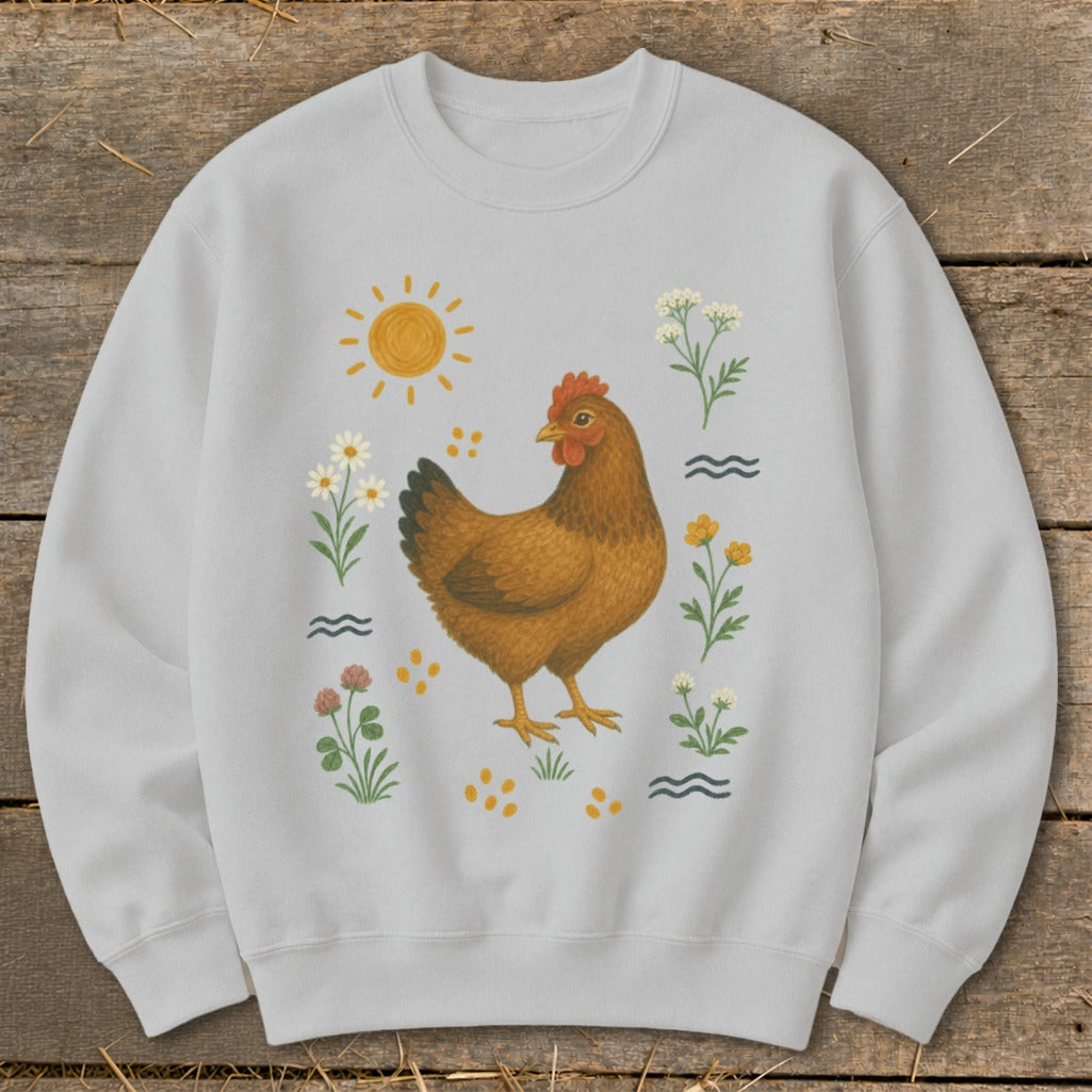Light grey sweatshirt with a chicken and floral illustration, featuring a sun and scattered dots.