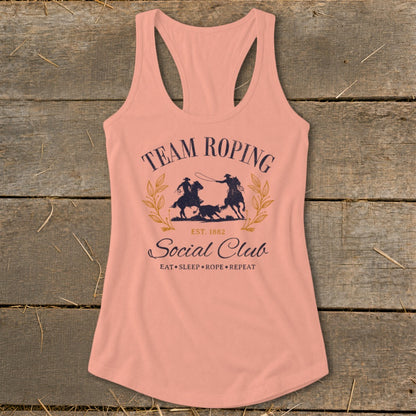 Peach tank top with "Team Roping Social Club" graphic and rodeo scene.