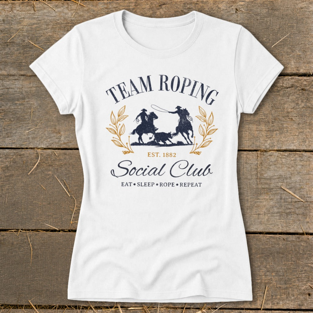 White t-shirt with "Team Roping Social Club Est. 1882" graphic.