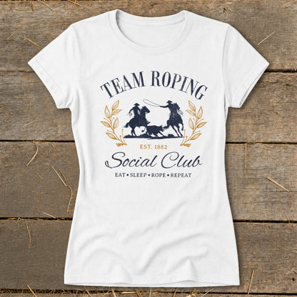White t-shirt with "Team Roping Social Club Est. 1882" graphic.
