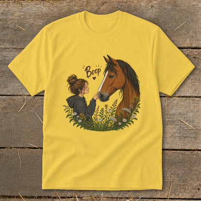 Illustration of girl touching horse's nose with text "Boop" and heart.