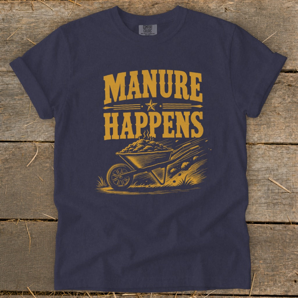 Dark blue t-shirt with yellow graphic of wheelbarrow and "MANURE HAPPENS" text.