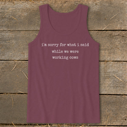 Maroon tank top with white text "i'm sorry for what i said while we were working cows."