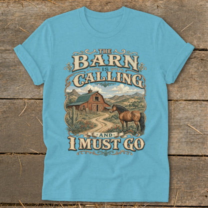Light blue t-shirt with "The Barn is Calling and I Must Go" text and barn scene.