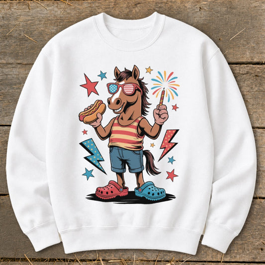 Cartoon horse in sunglasses holds hot dog and sparkler with fireworks.
