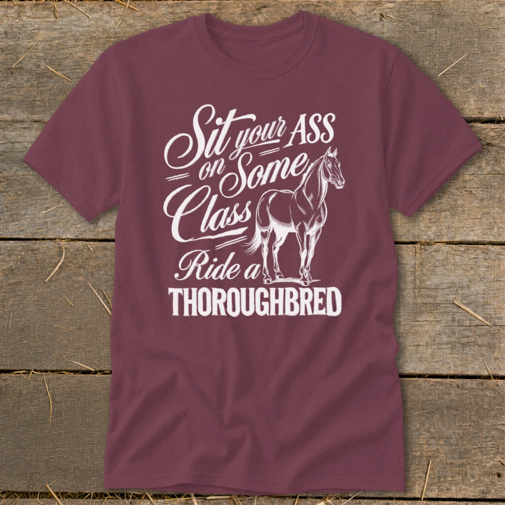 A maroon crewneck t-shirt featuring white text and an illustration of a horse.