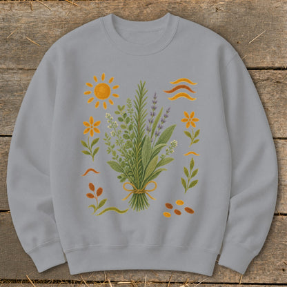Grey sweatshirt with a central bouquet of herbs and surrounding sun, flowers, and seeds.