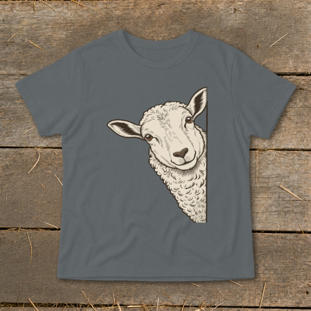 Sheep peeking from the side on a gray t-shirt with a rustic wooden background.