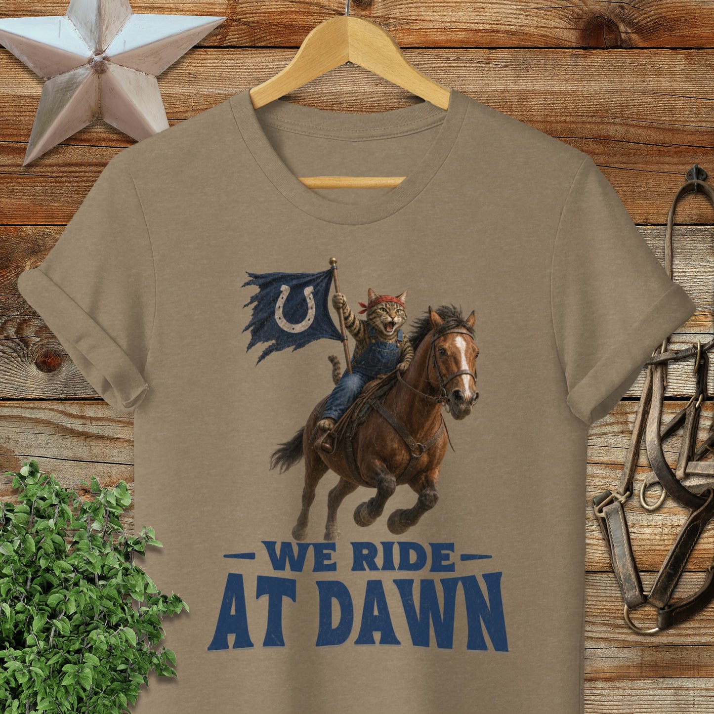 Cat in cowboy hat rides horse carrying Indianapolis Colts flag.