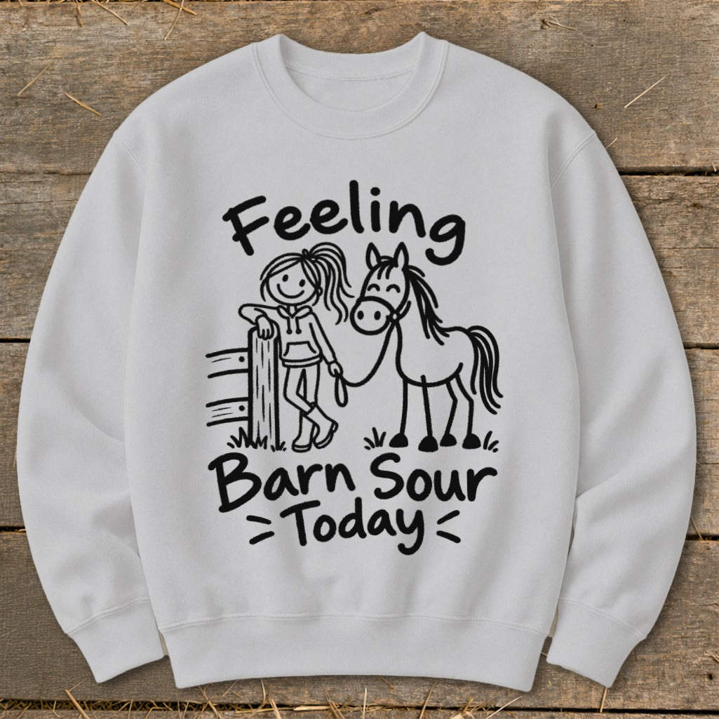 White sweatshirt with black graphic of a girl and horse, reading "Feeling Barn Sour Today".