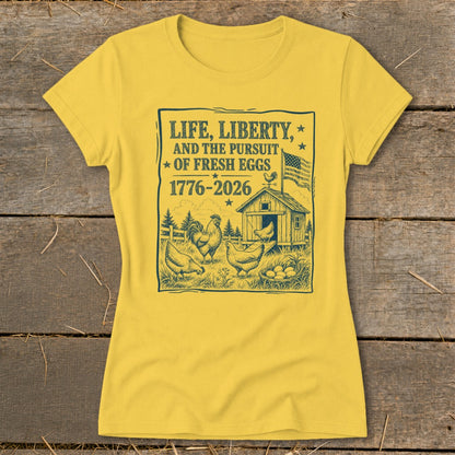 Yellow t-shirt with "Life, Liberty, and the Pursuit of Fresh Eggs 1776-2026" graphic.