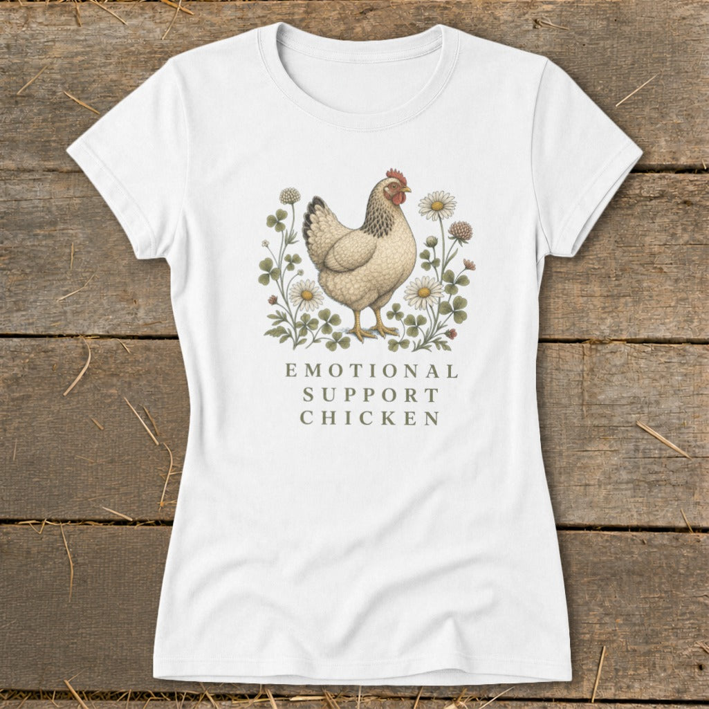 White t-shirt with a chicken illustration surrounded by flowers and text that reads "EMOTIONAL SUPPORT CHICKEN".