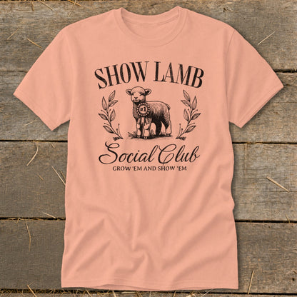 Peach t-shirt with a graphic of a lamb, the words "SHOW LAMB Social Club", and "GROW 'EM AND SHOW 'EM".