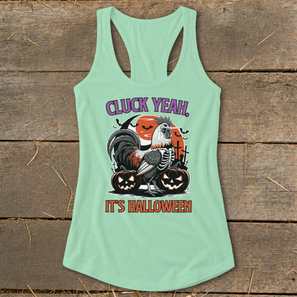Mint green tank top with a rooster skeleton and pumpkins graphic saying "CLUCK YEAH, IT'S HALLOWEEN".