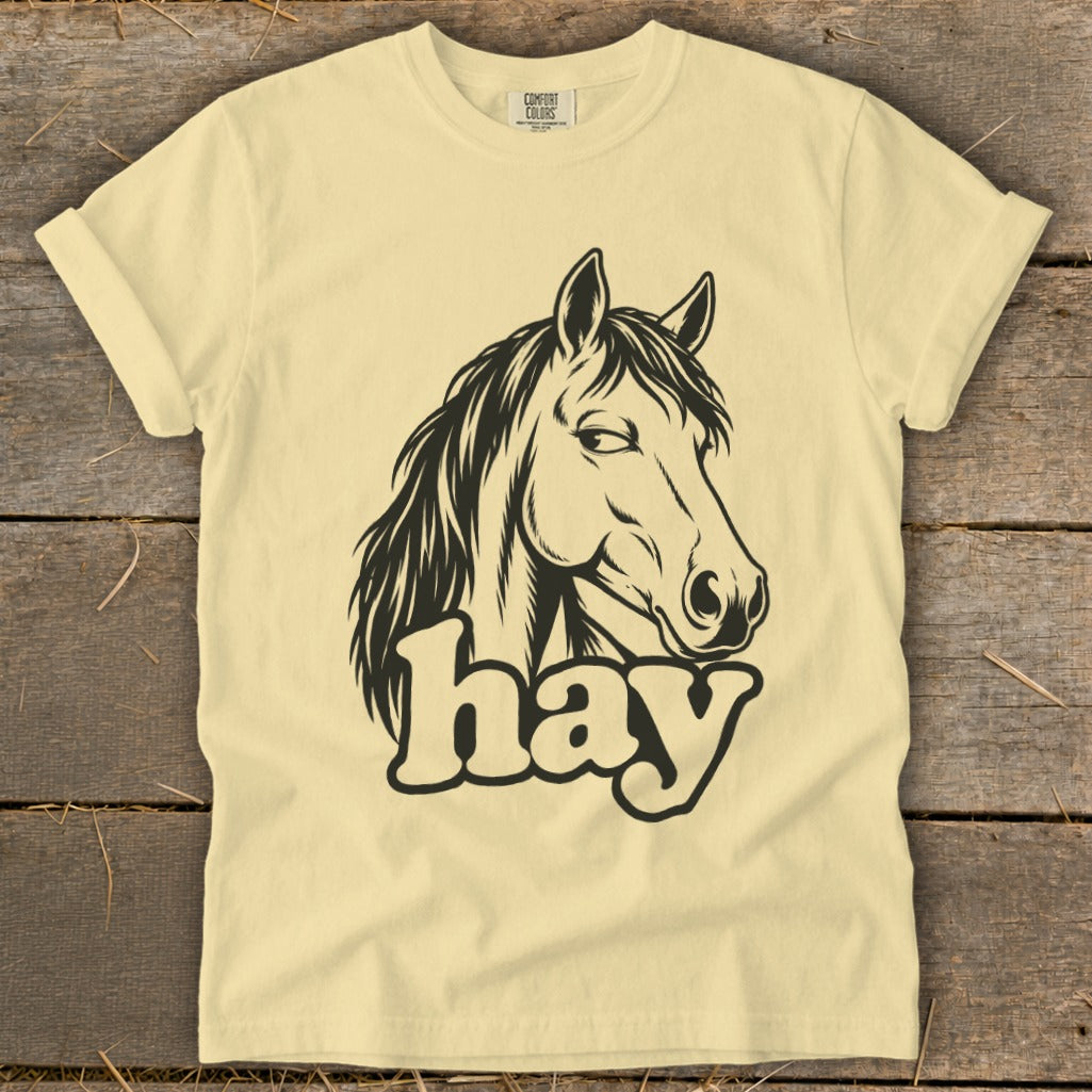 Light yellow t-shirt with black horse head graphic and "hay" text.