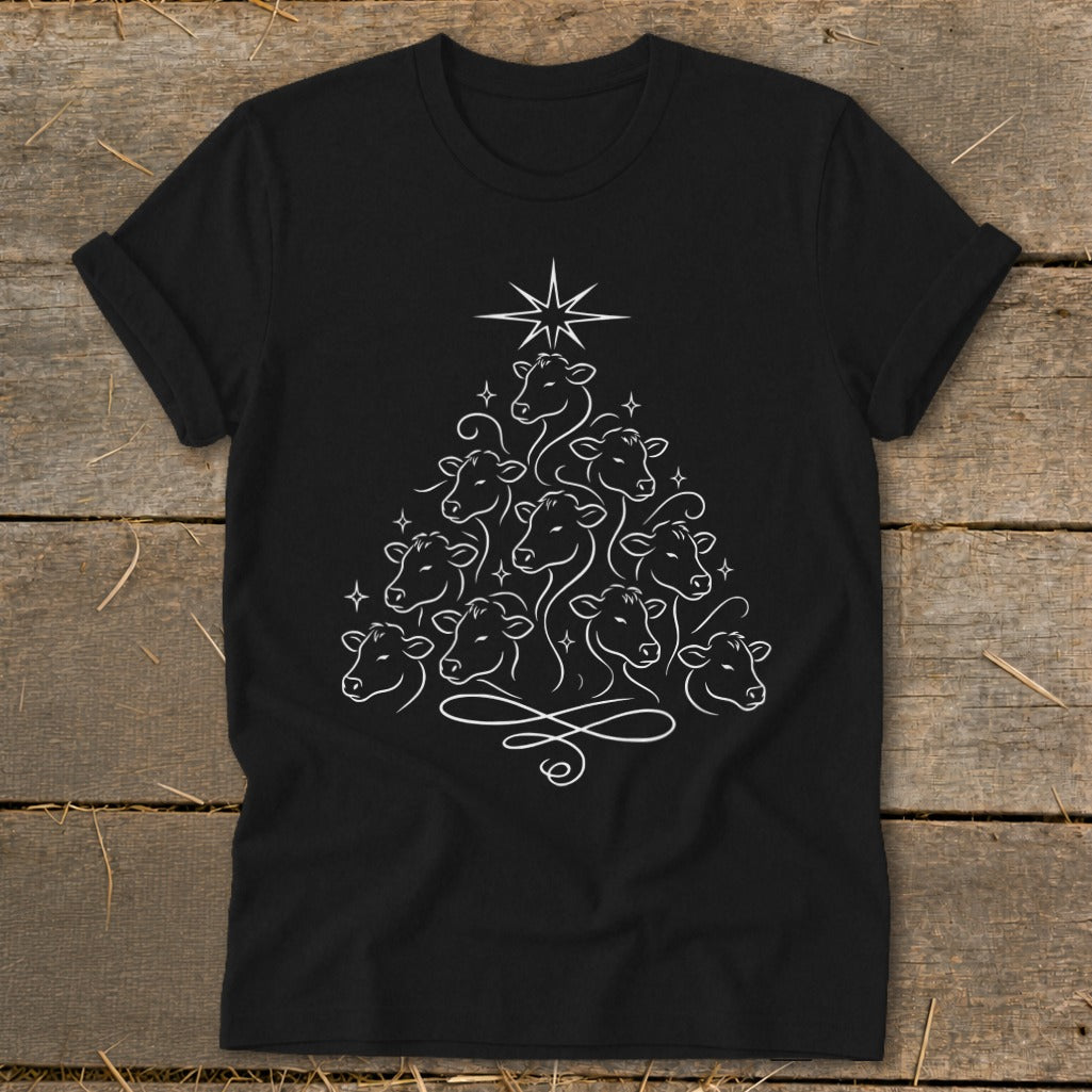 Black t-shirt with white line art of cows forming a Christmas tree shape with a star.