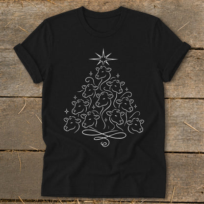 Black t-shirt with white line art of cows forming a Christmas tree shape with a star.