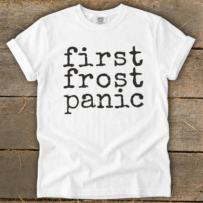 White t-shirt with black text "first frost panic" on the front.