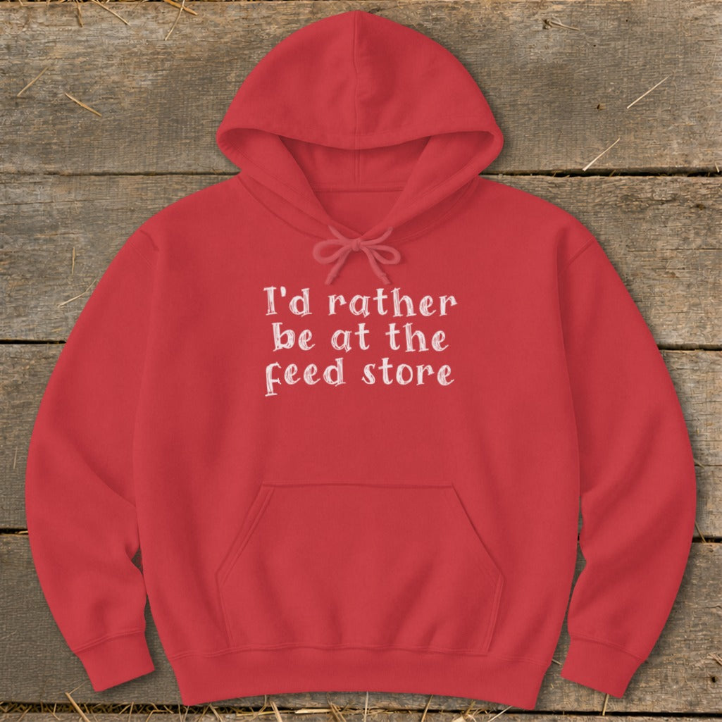Red hoodie with white text that reads "I'd rather be at the feed store."