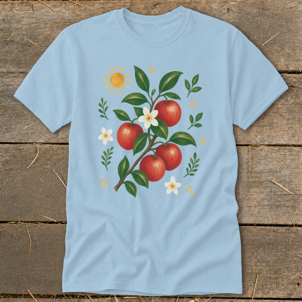 Light blue t-shirt with illustration of an apple branch, sun, and flowers.