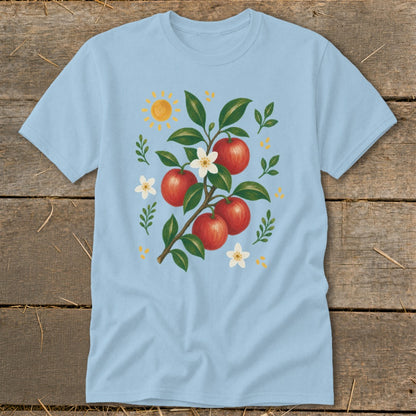 Light blue t-shirt with illustration of an apple branch, sun, and flowers.