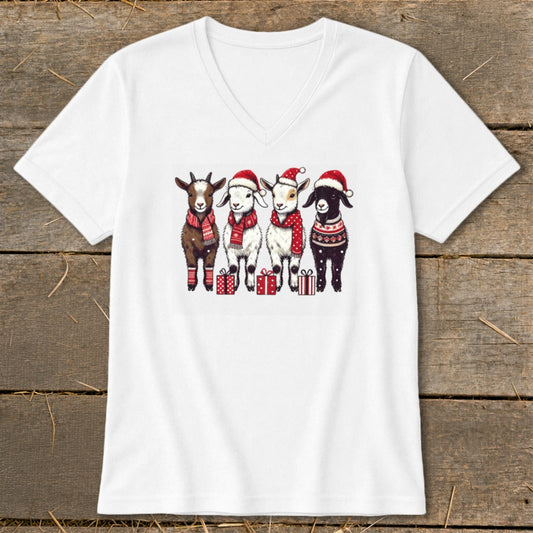 Four goats in Santa hats and scarves stand with presents.
