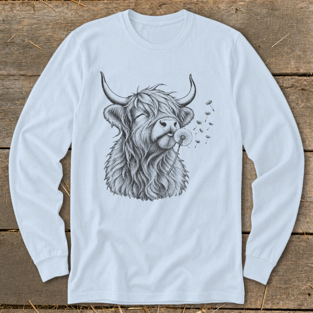 Long-sleeved shirt with a sketch of a Highland cow blowing a dandelion.