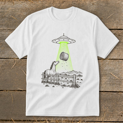 UFO abducting a hay bale over a horse and fence in a field.