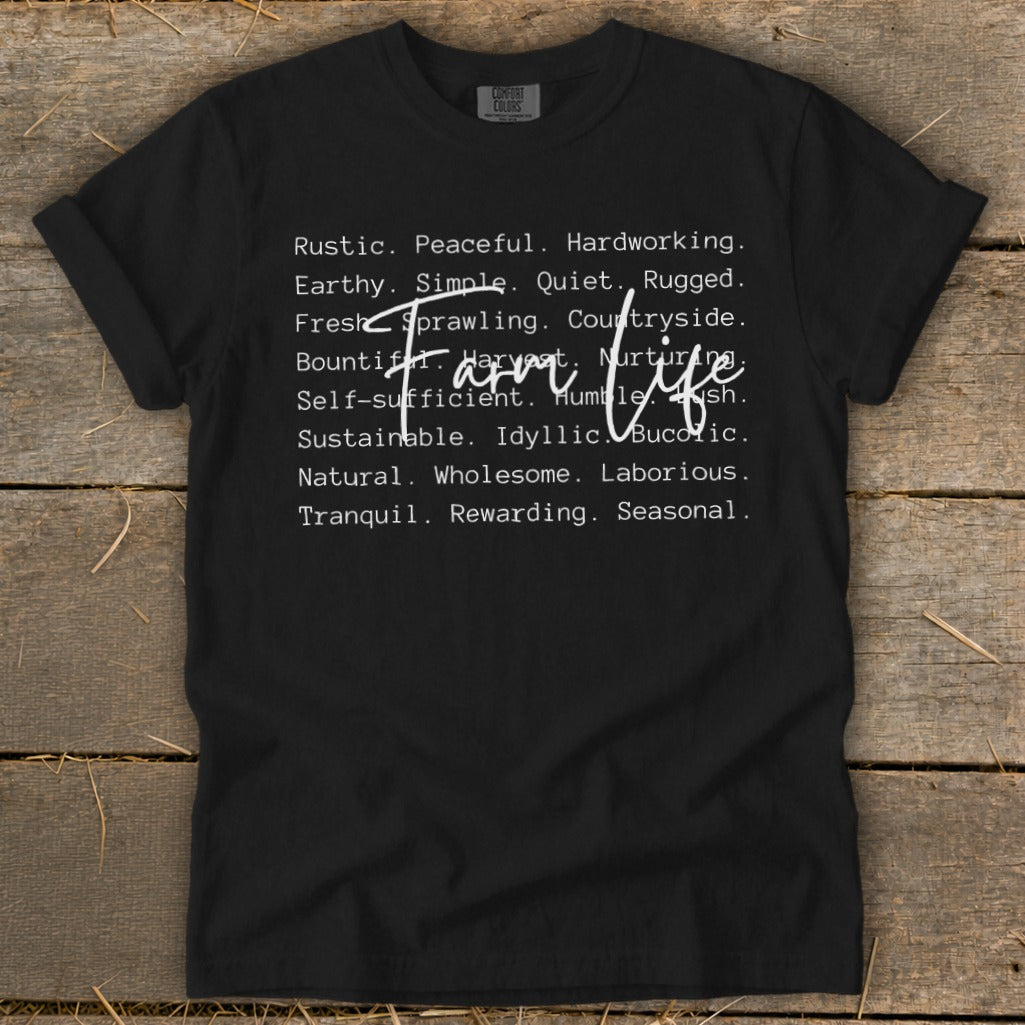Black t-shirt with white text reading "Farm life" and descriptive words.