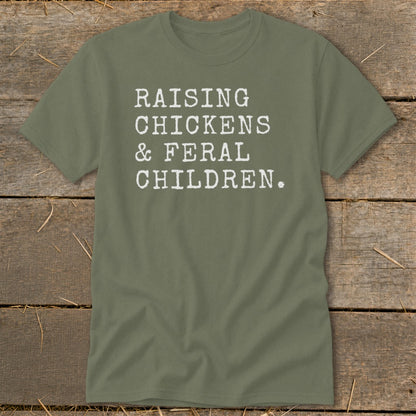 Green t-shirt with white text reading "RAISING CHICKENS & FERAL CHILDREN."