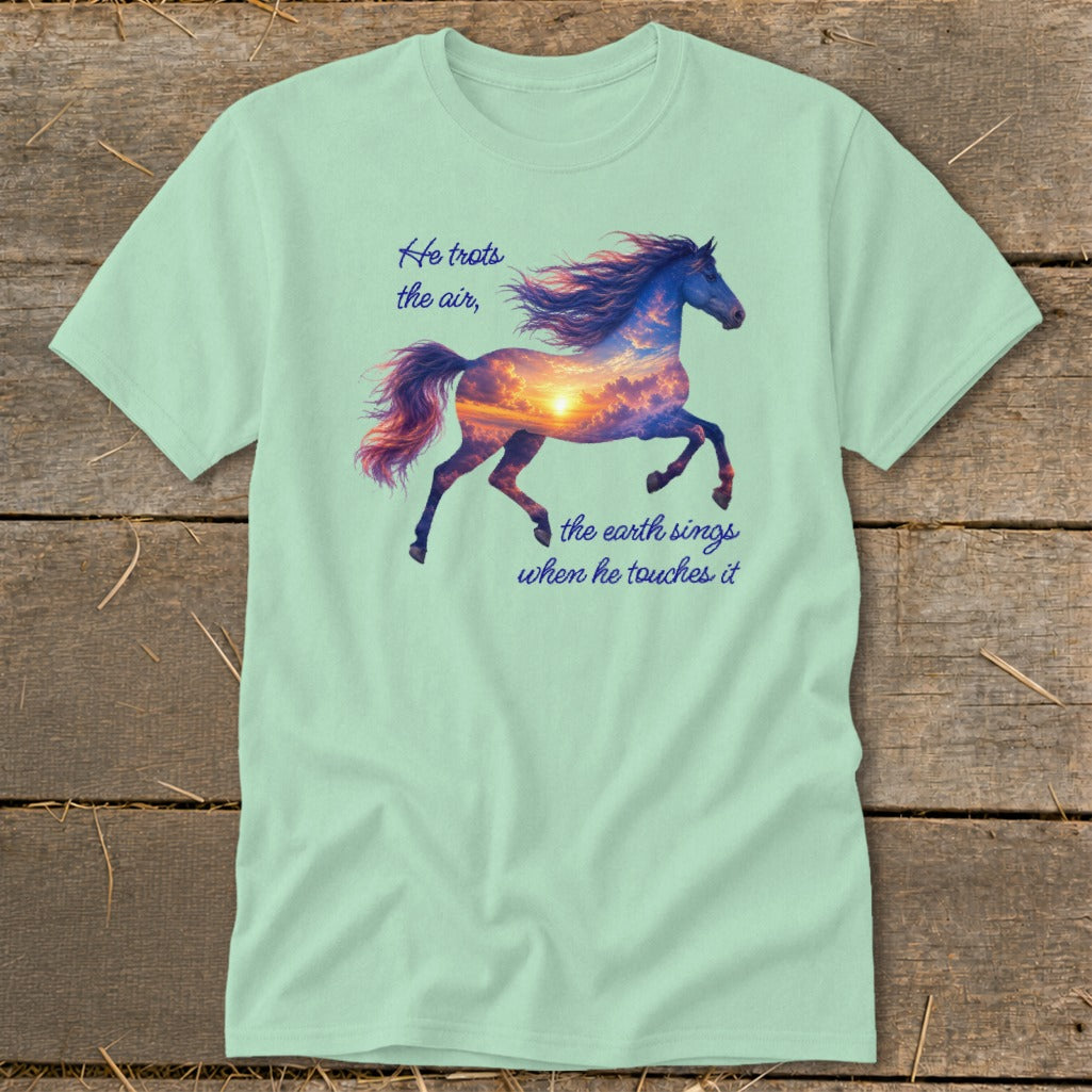 Light green t-shirt featuring a galloping horse graphic filled with a sunset sky and quote text.