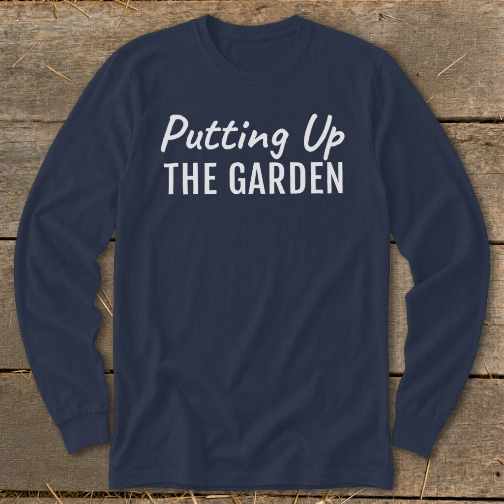 Navy long sleeve shirt with white text "Putting Up THE GARDEN".