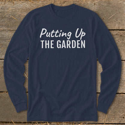 Navy long sleeve shirt with white text "Putting Up THE GARDEN".