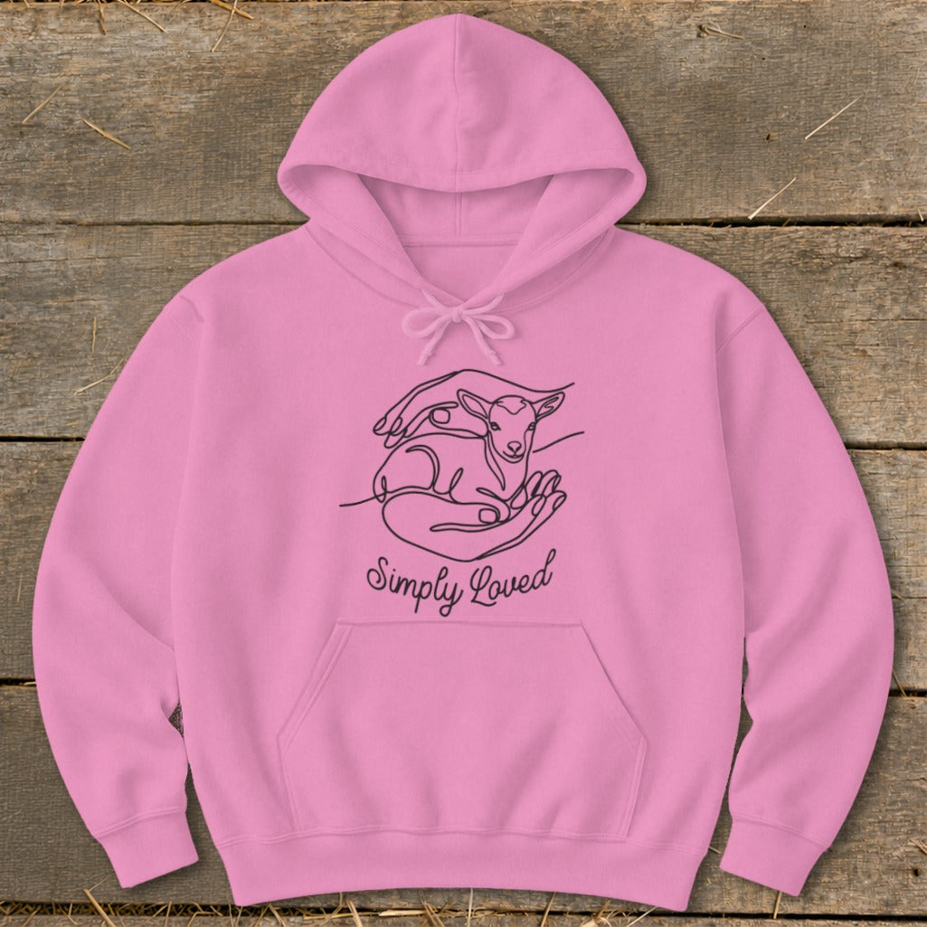 Pink hoodie with a line drawing of hands holding a lamb and the text "Simply Loved".