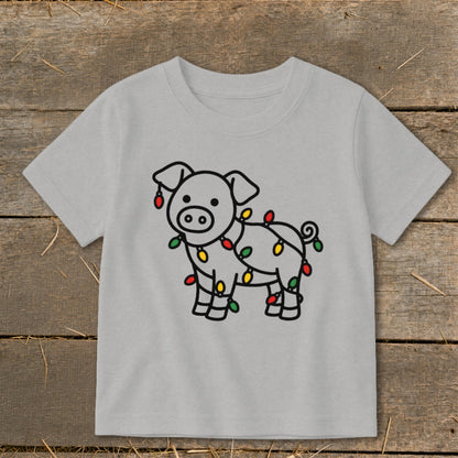 Gray short-sleeved children's t-shirt featuring a black-outlined pig tangled in colorful Christmas lights.