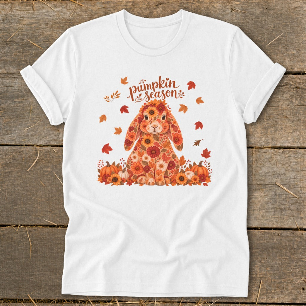 White t-shirt with a floral bunny and "pumpkin season" text surrounded by leaves.