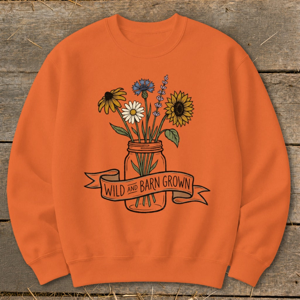 Orange sweatshirt with "Wild and Barn Grown" text and a mason jar of wildflowers.