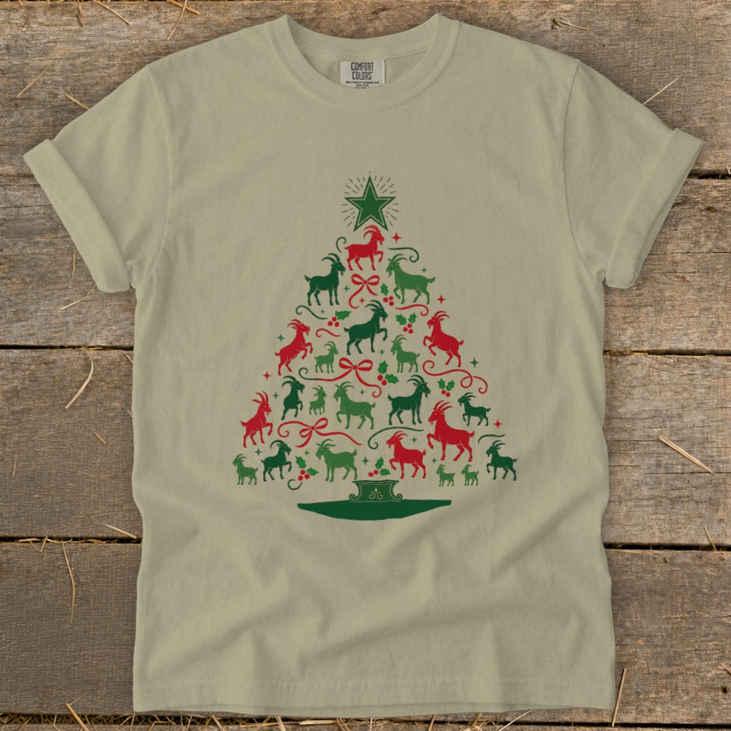 Tan t-shirt with Christmas tree made of red and green goats and holly.